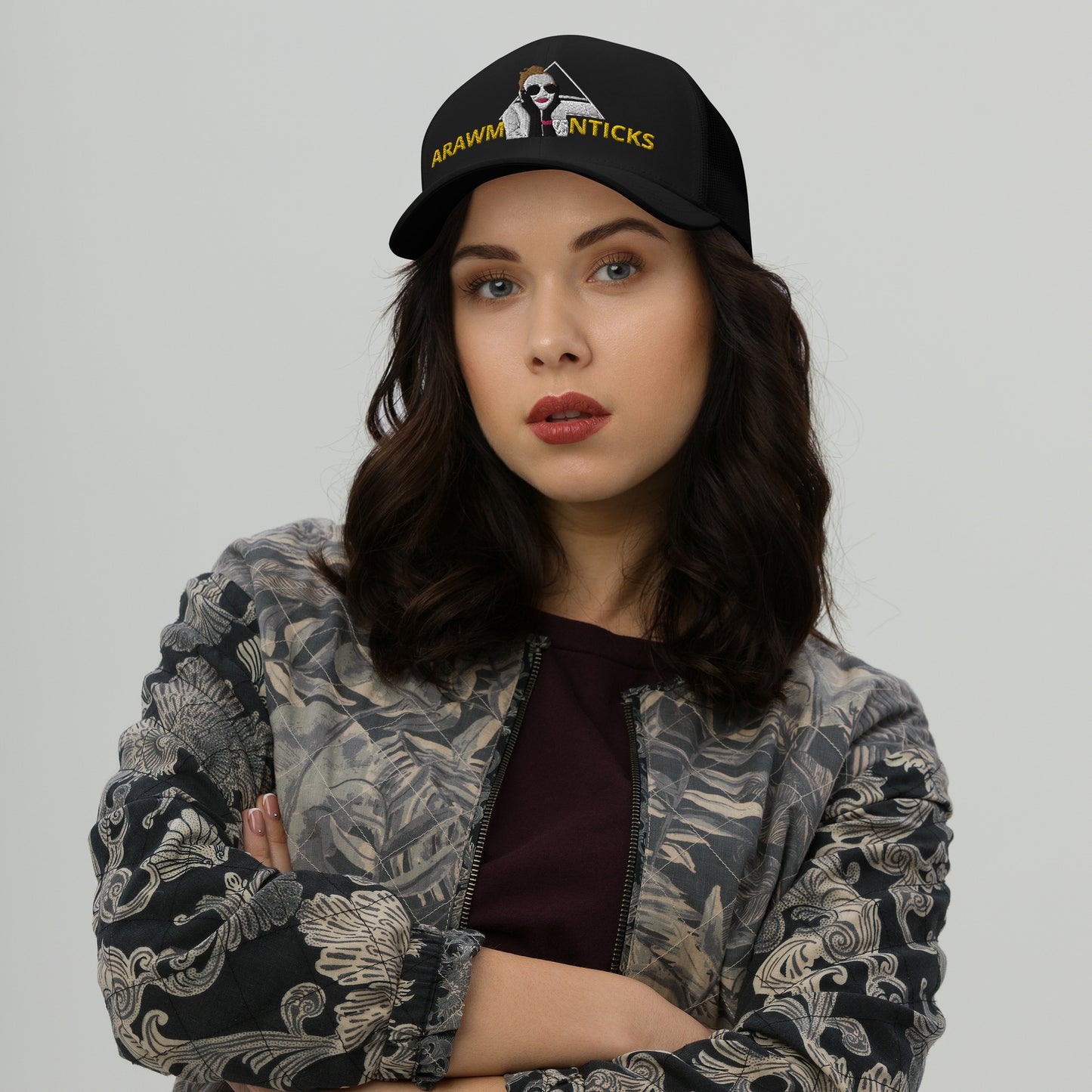 Female Model Wearing Black Trucker Cap with OMG Girl and Pyramid Design Front Embroidery - ARAWMANTICKS