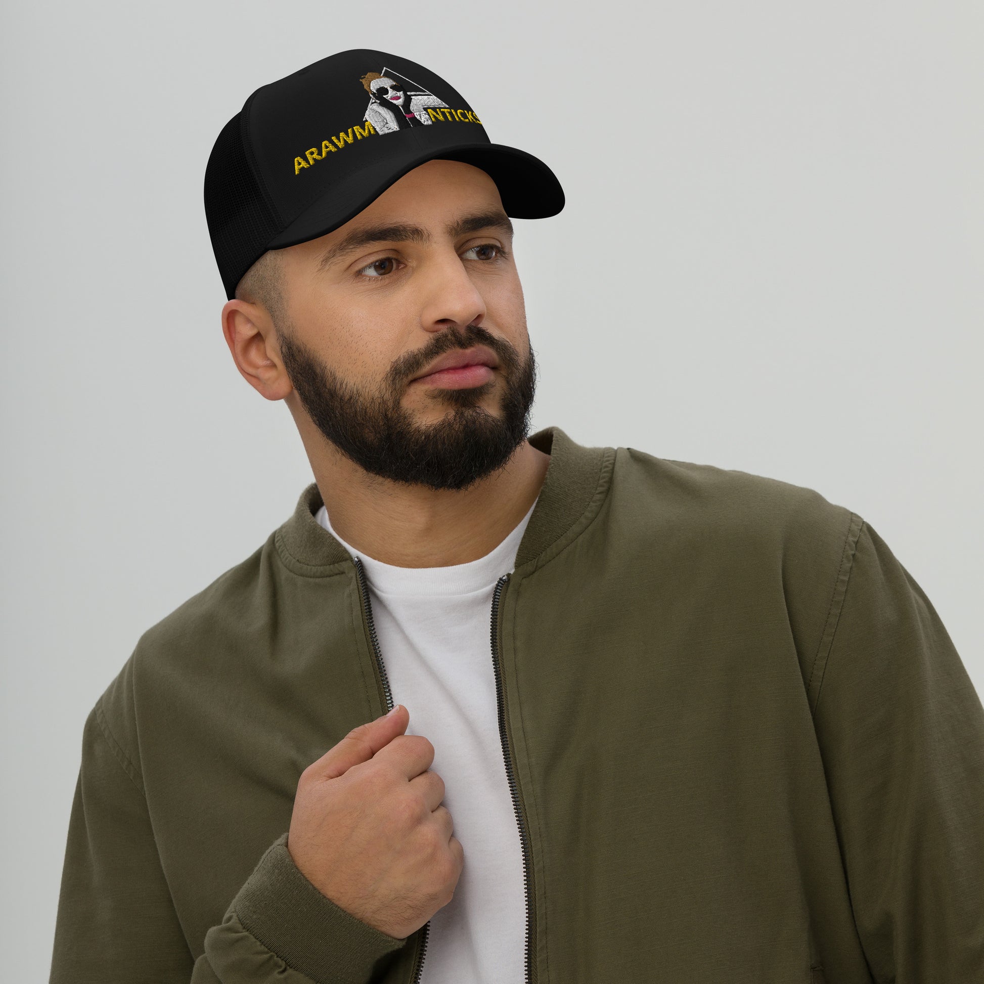 Male Model Wearing Black Trucker Cap with OMG Girl and Pyramid Design Front Embroidery - ARAWMANTICKS