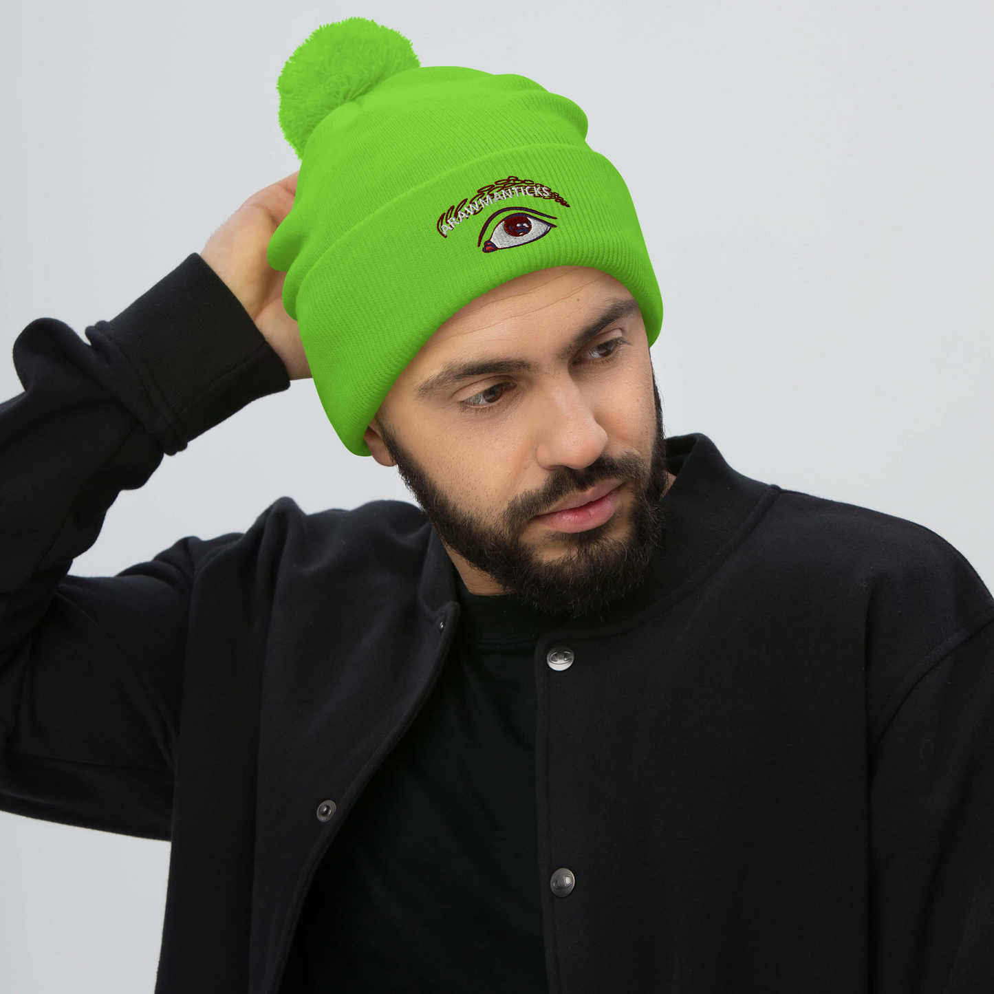 Male Model Wearing Neon Green Pom-Pom Beanie with Eye Embroidery - ARAWMANTICKS